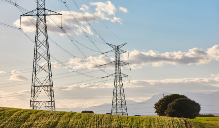 power lines in front of a blue sky